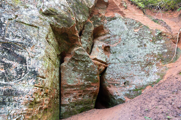 Sandstone cliffs at Krauklu aiza un ala (Raven's Ravine and Cave) in Gauja National Park, Sigulda, Latvia