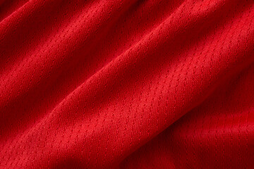 Fototapeta na wymiar Red sports clothing fabric football shirt jersey texture background