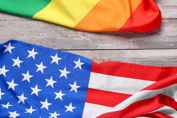 Flags of USA and LGBT on wooden background