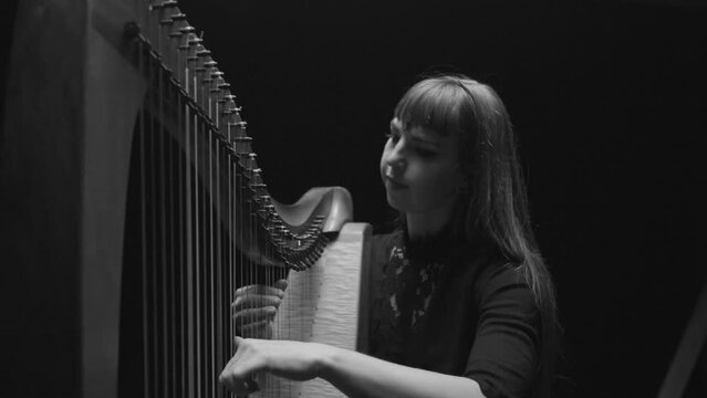 Woman Playing Harp