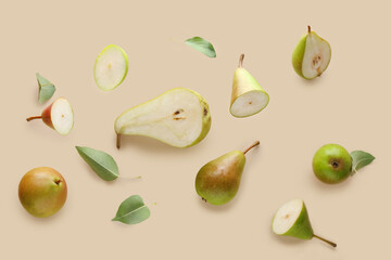 Flying ripe pears on beige background