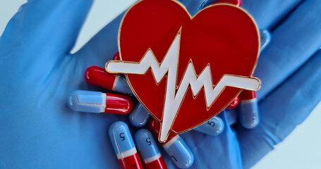 Antibiotics for treatment of the heart and pills in hands of doctors
