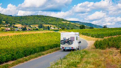 Motorhome in country road with vineyard- travel, tourism in France