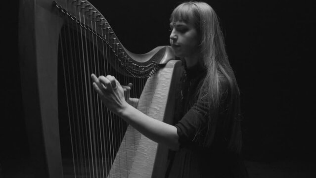 Woman Playing Harp in Black and White and Slow Motion