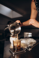 Woman making candles at white table, closeup