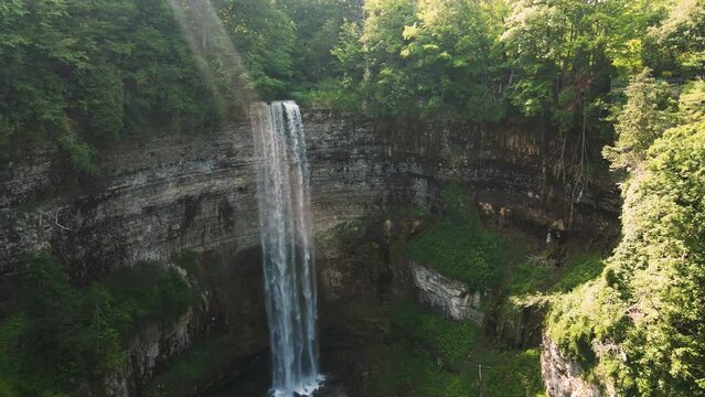Light rays stream through mist above tew falls in Ontario Canada