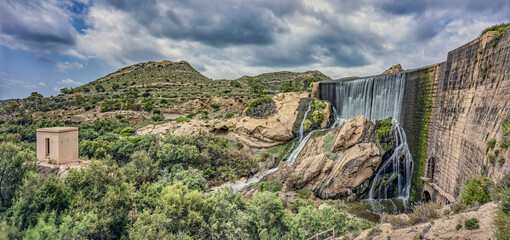 Elche swamp. Spectacular panorama and waterfall in the Elche reservoir. In Elche, Alicante, Valencian community, Spain