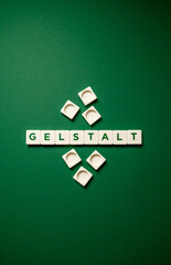 the word gestalt on a green background.gestalt consists of letters.