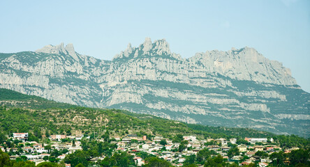 Fototapeta na wymiar Panoramic view of Montserrat Barcelona, in Catalonia. Village houses down the mountain.