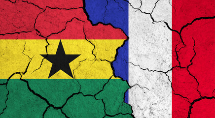 Flags of Ghana and France on cracked surface - politics, relationship concept