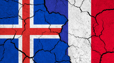 Flags of Iceland and France on cracked surface - politics, relationship concept
