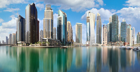 Dubai marina promenade in UAE. Highrise residential buildings, business skyscrapers