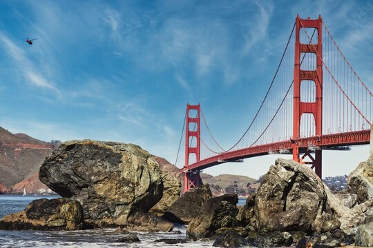 Golden Gate Bridge Bathed in Sunlight. he warm hues illuminate the architectural masterpiece, creating a radiant and unforgettable image