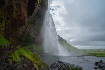 Seljalandsfoss waterfall in summer season in Iceland. Famous nature landscape background