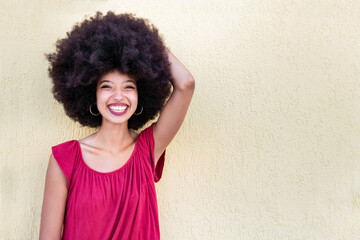 Cheerful young woman with Afro hairdo