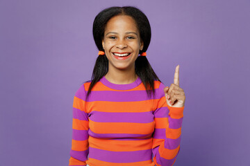Little kid teen girl of African American ethnicity 15 years old wear striped orange sweatshirt hold...