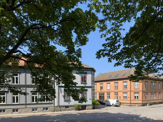 Obraz premium Happy walking in old Fredrikstad on a great warm summer day, with many old buildings, Norway 