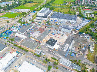 Aerial view of the logistics park with warehouse, loading hub and many semi trucks with cargo...