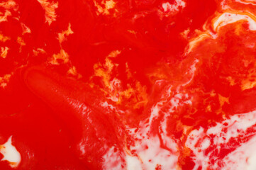 Close up of red ink in water with copy space on white background