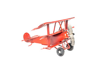 airplane toy red made of metal. White background