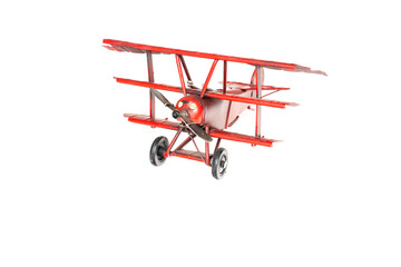 airplane toy red made of metal. White background © дмитрий кузнецов