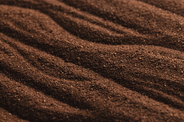 Close up of pattern of brown sand and copy space background