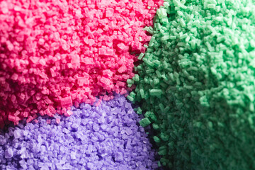 Close up of heaps of multi coloured sand