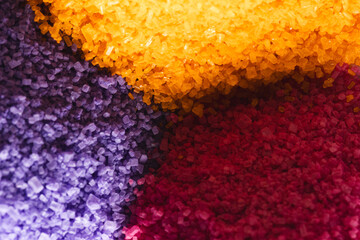 Close up of heaps of multi coloured sand