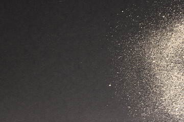 Fototapeta premium Close up of sand and copy space on black background