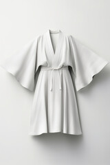 A white robe hanging on a wall. Digital image.