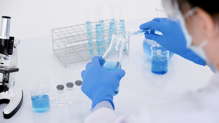 Young female scientist working in the laboratory.