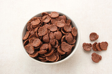 Bowl of cereal chocolate flavor, sweet crunchy 
