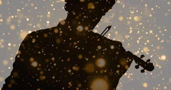 Animation of light spots moving over silhouette of man playing violin