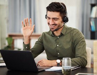 Man, remote work and virtual assistant with headphones at laptop for video call, voip communication...