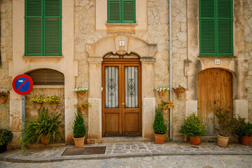 Fototapeta na wymiar Flower-filled entrance to a traditional house in Valldemossa, Mallorca