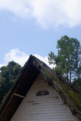 A traditional house with a unique architecture, made of wood and bamboo with a roof of palm fiber in Kampung Naga