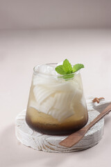 Ais Janda Pulang is Malaysian Young Coconut Meat with Gula Melaka Syrup, Summer Dessert. Es Degan or Es Kelapa Muda Gula Aren is Young Coconut with Palm Sugar Syrup in Indonesia