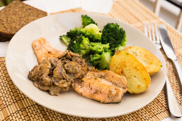 Fried fillet of river trout with a complex side dish