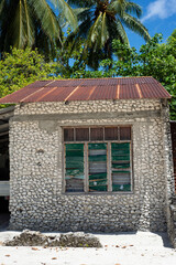 Typical Maldivian house made of coral - 628017559