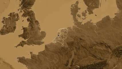 Shape of Netherlands with regional borders. Sepia elevation.