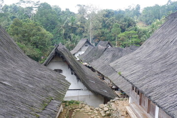A traditional house with a unique architecture, made of wood and bamboo with a roof of palm fiber in Kampung Naga
