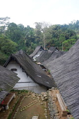 A traditional house with a unique architecture, made of wood and bamboo with a roof of palm fiber in Kampung Naga