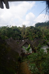 A traditional house with a unique architecture, made of wood and bamboo with a roof of palm fiber in Kampung Naga