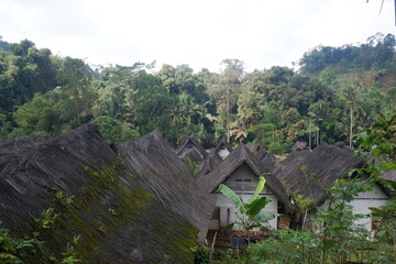 A traditional house with a unique architecture, made of wood and bamboo with a roof of palm fiber in Kampung Naga