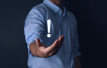 Businessman hand showing white exclamation mark, business development concept error warning...