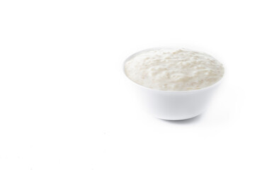 Rice pudding. Arroz con leche. Rice pudding in white bowl isolated on white background. Copy space