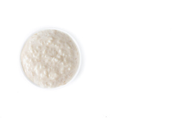 Rice pudding. Arroz con leche. Rice pudding in white bowl isolated on white background. Top view. Copy space