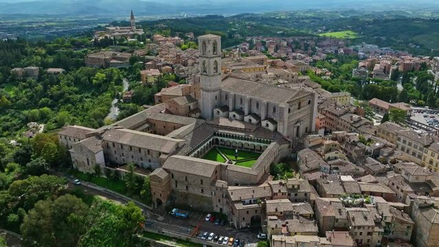 Aerial of the town of Borgo XX Giugno and the Convent of San Domenico (Basilica di San Domenico), Perugia, Province of Perugia, Italy. Drone orbit shot