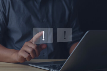 Businessman hand showing white exclamation mark, business development concept error warning notification	
