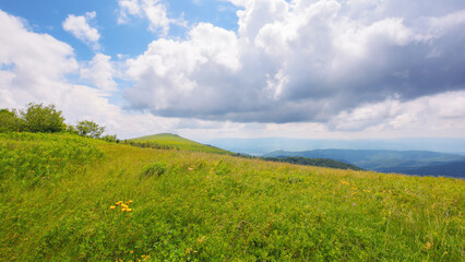 nature scenery with hills and meadows. summer mountain landscape with clouds on the sky. view from runa mountain